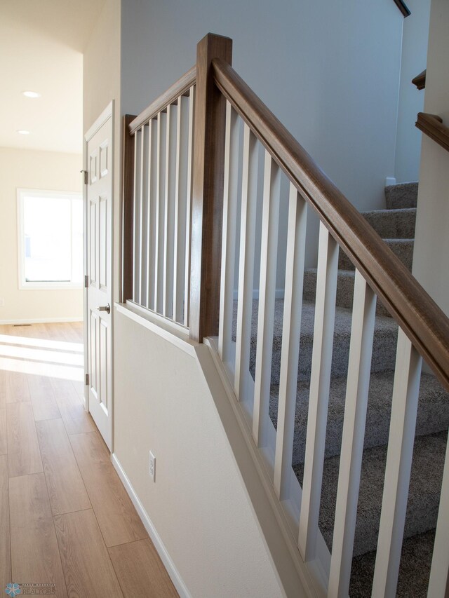 302 Neuman Blvd, Colfax, ND 58018 - stairs with wood finished floors and recessed lighting