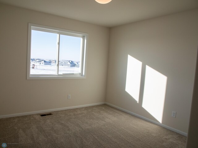 302 Neuman Blvd, Colfax, ND 58018 - carpeted spare room featuring baseboards