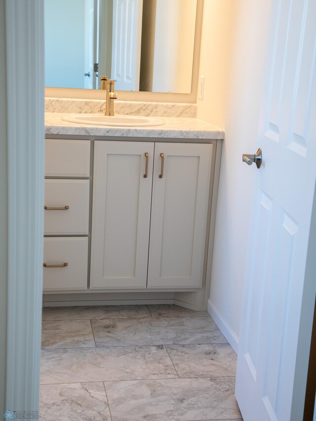 302 Neuman Blvd, Colfax, ND 58018 - bathroom with marble finish flooring and vanity
