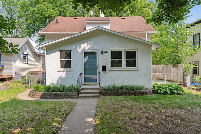 5529 40th Ave S, Minneapolis, MN 55417 - bungalow-style home featuring entry steps, stucco siding, and a shingled roof