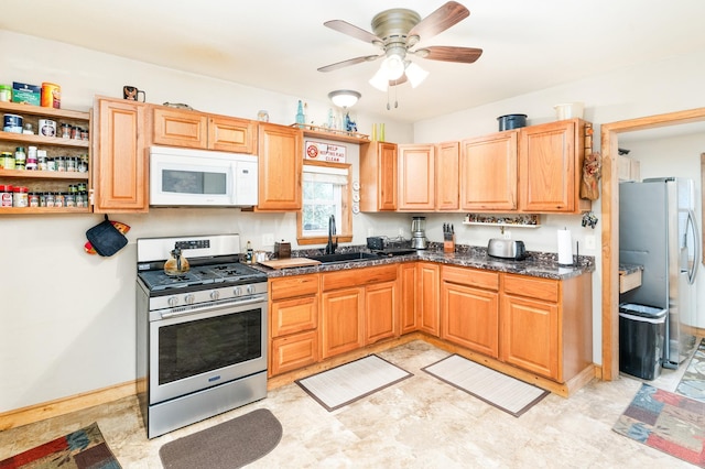 14 3rd St, Proctor, MN 55810 - kitchen with appliances with stainless steel finishes, dark countertops, ceiling fan, and open shelves