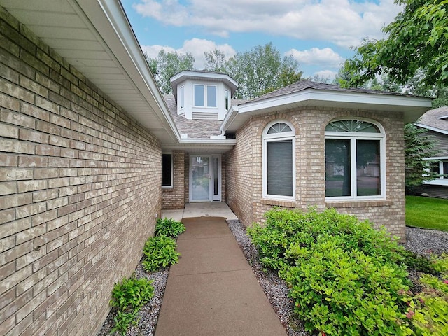 1207 Silverthorn Ct, Shoreview, MN 55126 - doorway to property with brick siding and a shingled roof