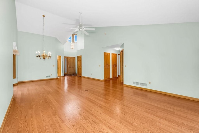 1207 Silverthorn Ct, Shoreview, MN 55126 - empty room featuring a chandelier, high vaulted ceiling, a ceiling fan, and light wood finished floors
