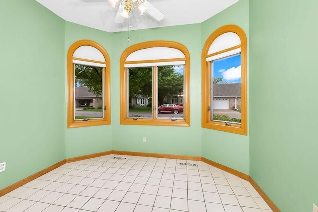 1207 Silverthorn Ct, Shoreview, MN 55126 - unfurnished room featuring healthy amount of natural light, ceiling fan, and light tile patterned floors