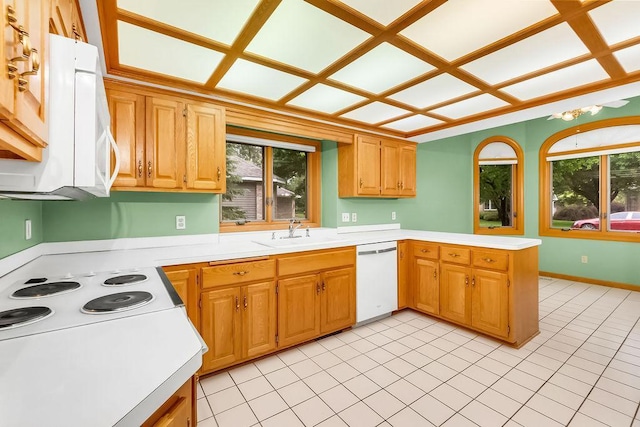 1207 Silverthorn Ct, Shoreview, MN 55126 - kitchen featuring white appliances, a peninsula, light countertops, and light tile patterned floors