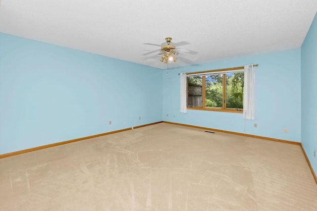 1207 Silverthorn Ct, Shoreview, MN 55126 - unfurnished room featuring a ceiling fan and light colored carpet