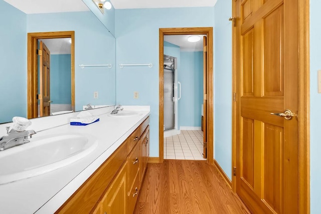 1207 Silverthorn Ct, Shoreview, MN 55126 - full bath with double vanity and wood finished floors