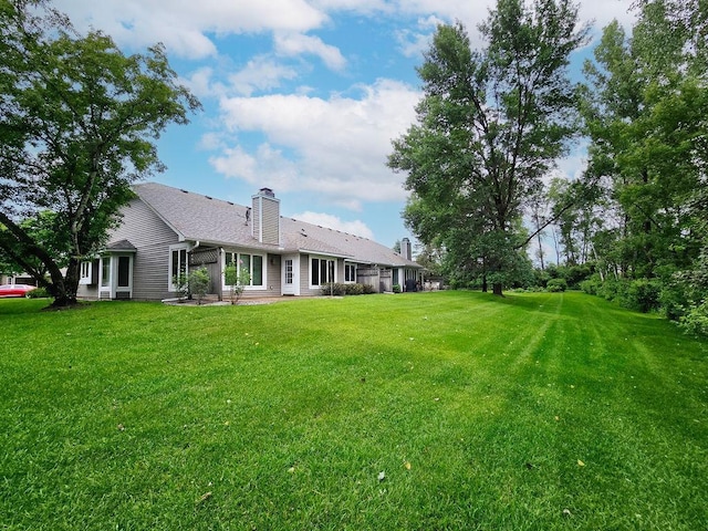 1207 Silverthorn Ct, Shoreview, MN 55126 - view of grassy yard featuring a patio area