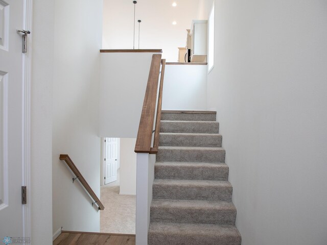 6310 83rd Ave S, Horace, ND 58047 - staircase with wood finished floors and baseboards