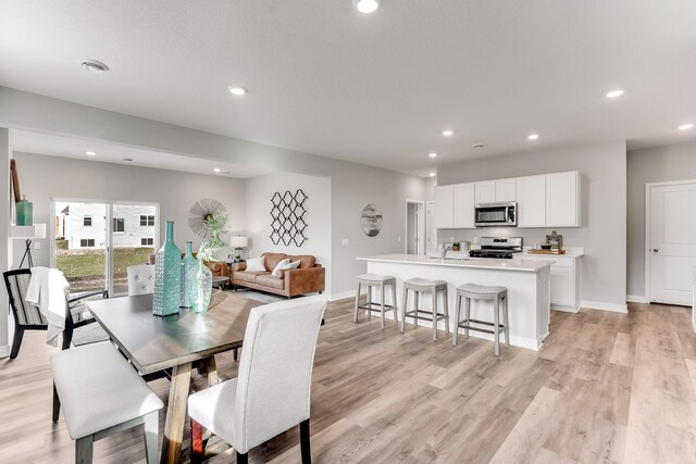 20898 Flanders Way, Farmington, MN 55024 - dining area featuring light wood-style flooring and recessed lighting