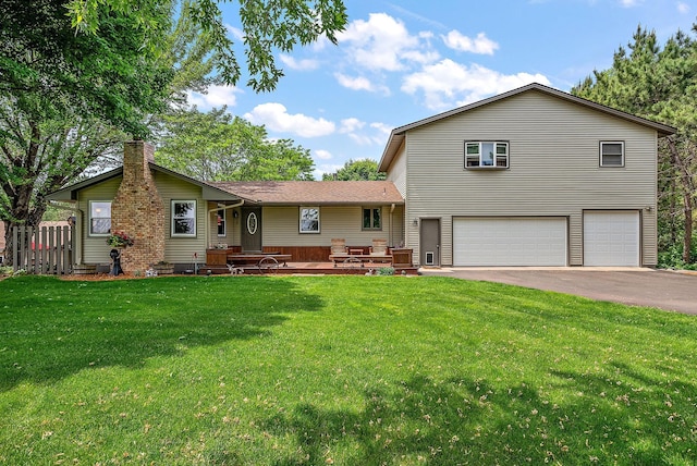 26684 Xylite St NE, Athens Twp, MN 55040 - tri-level home with an attached garage, driveway, and a chimney