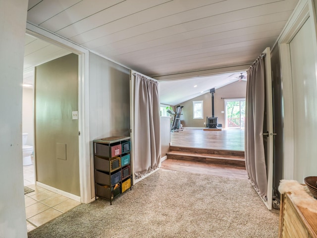 5936 Roosevelt Rd SE, Bemidji, MN 56601 - hallway featuring carpet flooring, lofted ceiling, and tile patterned floors