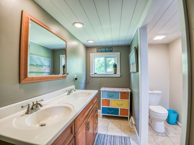 5936 Roosevelt Rd SE, Bemidji, MN 56601 - bathroom featuring double vanity and tile patterned flooring