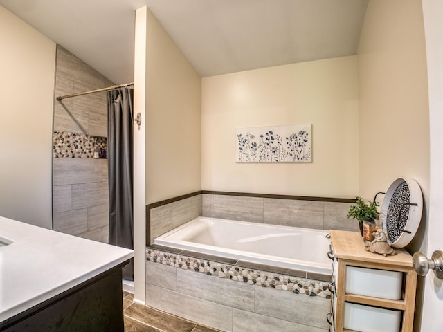5936 Roosevelt Rd SE, Bemidji, MN 56601 - bathroom featuring a bath, tiled shower, and vanity
