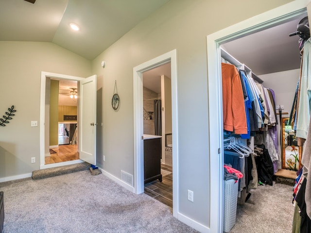 5936 Roosevelt Rd SE, Bemidji, MN 56601 - carpeted bedroom with lofted ceiling and ensuite bath