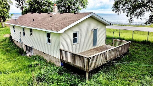 7165 US Highway 169, Garrison, MN 56450 - back of property with roof with shingles and a deck with water view