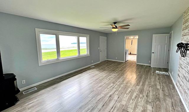 7165 US Highway 169, Garrison, MN 56450 - unfurnished living room featuring a ceiling fan and wood finished floors