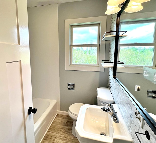 7165 US Highway 169, Garrison, MN 56450 - bathroom with a tub and wood finished floors