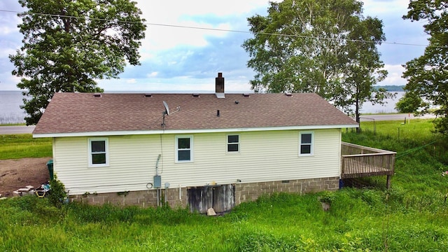 7165 US Highway 169, Garrison, MN 56450 - back of property featuring roof with shingles, crawl space, and a deck