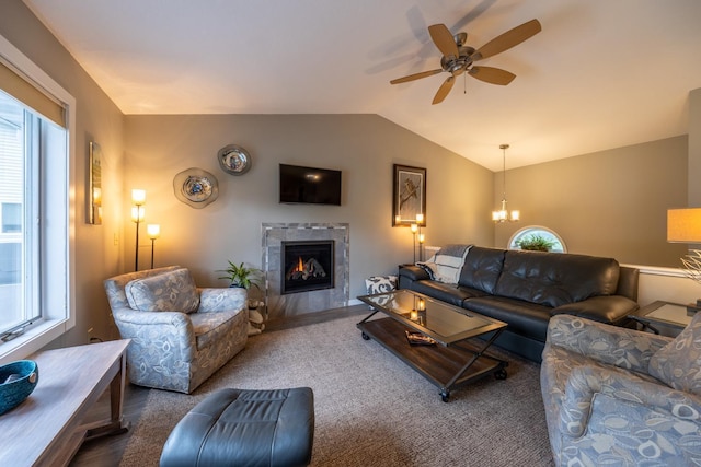 609 Main St E, Wabasha, MN 55981 - carpeted living area featuring healthy amount of natural light, lofted ceiling, a fireplace, a ceiling fan, and a chandelier
