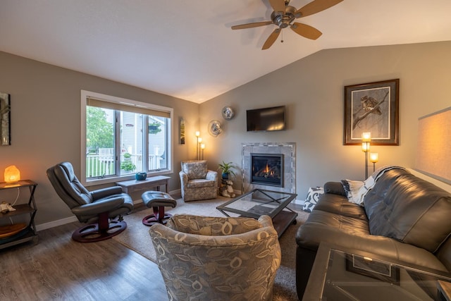 609 Main St E, Wabasha, MN 55981 - living area featuring lofted ceiling, wood finished floors, a ceiling fan, and a tile fireplace