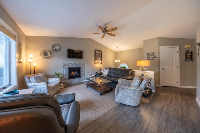 609 Main St E, Wabasha, MN 55981 - living area with dark wood-type flooring, a ceiling fan, lofted ceiling, healthy amount of natural light, and a tiled fireplace