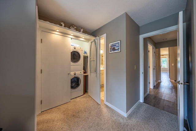 609 Main St E, Wabasha, MN 55981 - laundry area with stacked washer and clothes dryer and carpet flooring