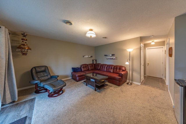 609 Main St E, Wabasha, MN 55981 - carpeted living area with baseboards and a textured ceiling