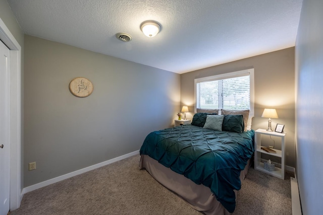 609 Main St E, Wabasha, MN 55981 - carpeted bedroom with a textured ceiling and baseboards