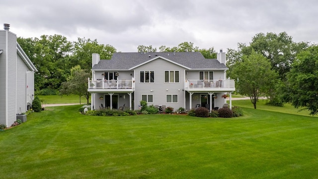 609 Main St E, Wabasha, MN 55981 - view of front of property with a chimney, a front lawn, and view of scattered trees