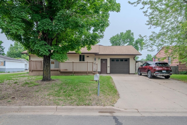 1009 7th St NE, Little Falls, MN 56345 - ranch-style house with a garage, driveway, a front lawn, and a wooden deck