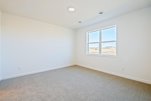 20264 Marsh Ct, Rogers, MN 55311 - spare room featuring baseboards and light carpet