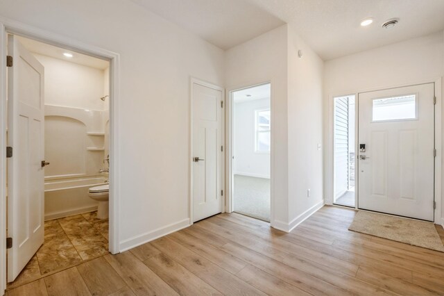20264 Marsh Ct, Rogers, MN 55311 - foyer featuring light wood finished floors and recessed lighting
