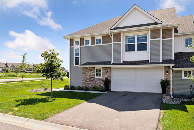 9462 Bridle Way, Victoria, MN 55386 - view of front of home featuring asphalt driveway, stone siding, a front lawn, and board and batten siding