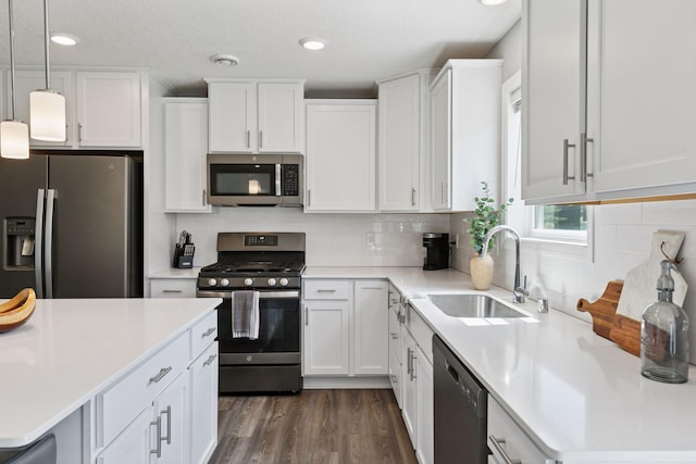 9462 Bridle Way, Victoria, MN 55386 - kitchen with stainless steel appliances, light countertops, white cabinetry, backsplash, and recessed lighting