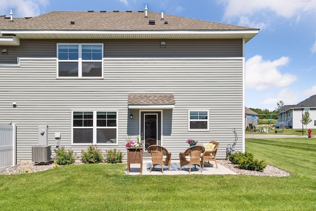 9462 Bridle Way, Victoria, MN 55386 - rear view of house with a patio, a lawn, and roof with shingles