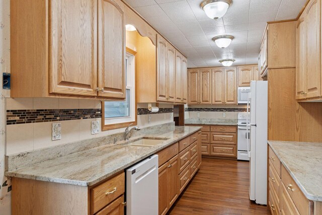 704 Highland Dr, New Prague, MN 56071 - kitchen featuring white appliances, dark wood-style flooring, light stone counters, tasteful backsplash, and light brown cabinets
