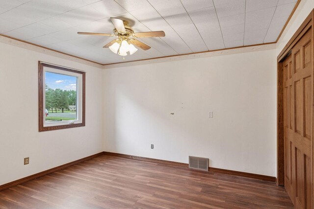 704 Highland Dr, New Prague, MN 56071 - empty room featuring wood finished floors, ceiling fan, and crown molding
