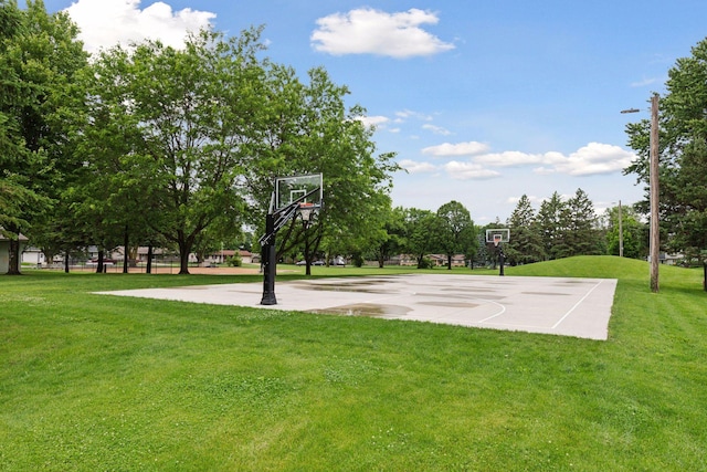 704 Highland Dr, New Prague, MN 56071 - view of basketball court featuring community basketball court and a lawn