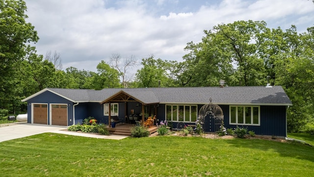 31340 Indigo Rd, Fountain, MN 55935 - single story home with a garage, concrete driveway, a front yard, and a wooden deck