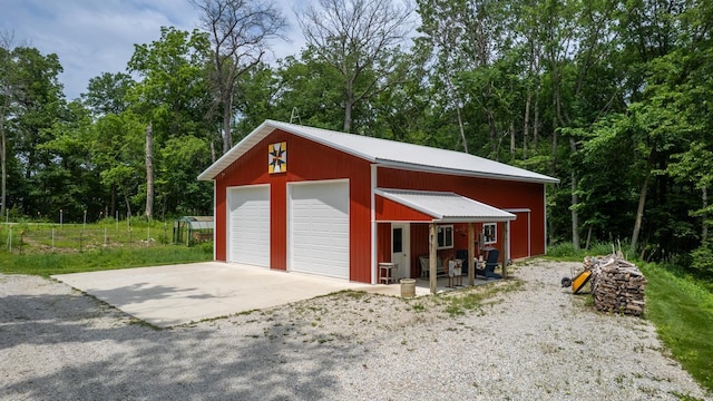31340 Indigo Rd, Fountain, MN 55935 - detached garage featuring view of wooded area