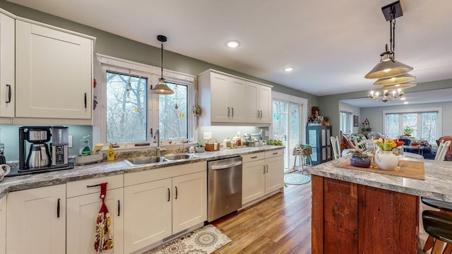 31340 Indigo Rd, Fountain, MN 55935 - kitchen featuring stainless steel dishwasher, plenty of natural light, light wood-type flooring, white cabinets, and recessed lighting