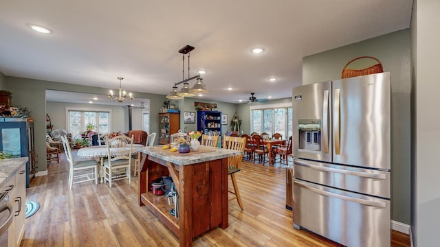 31340 Indigo Rd, Fountain, MN 55935 - kitchen with stainless steel refrigerator with ice dispenser, healthy amount of natural light, a chandelier, light countertops, and recessed lighting