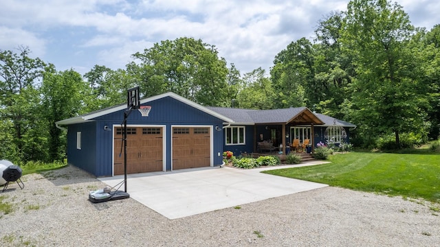 31340 Indigo Rd, Fountain, MN 55935 - view of front of property with covered porch, a front lawn, an attached garage, and driveway