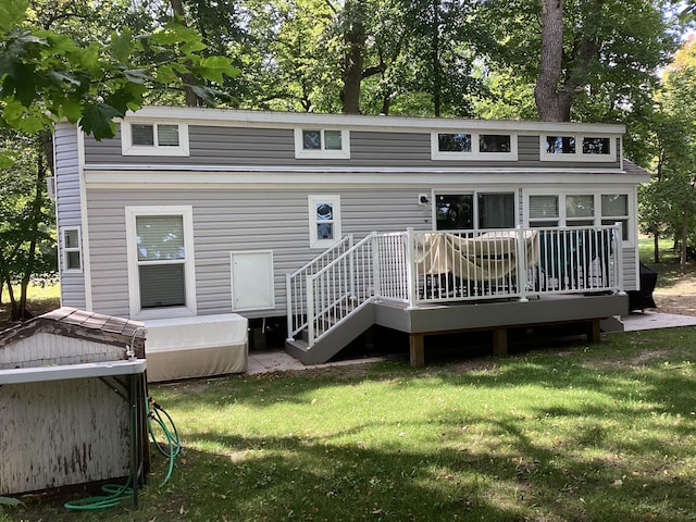 14275 Schuelke Beach Rd NW, Miltona, MN 56354 - rear view of property featuring a deck and a yard