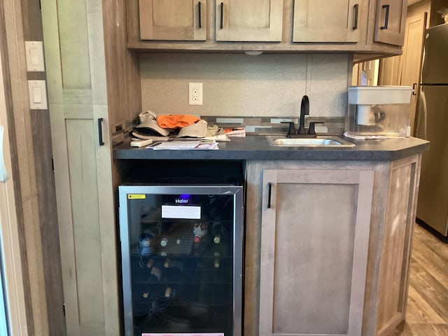 14275 Schuelke Beach Rd NW, Miltona, MN 56354 - bar area featuring wine cooler, freestanding refrigerator, and light wood-style floors