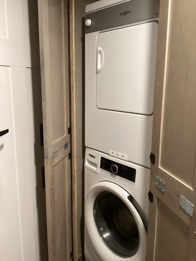 14275 Schuelke Beach Rd NW, Miltona, MN 56354 - washroom featuring stacked washer / drying machine