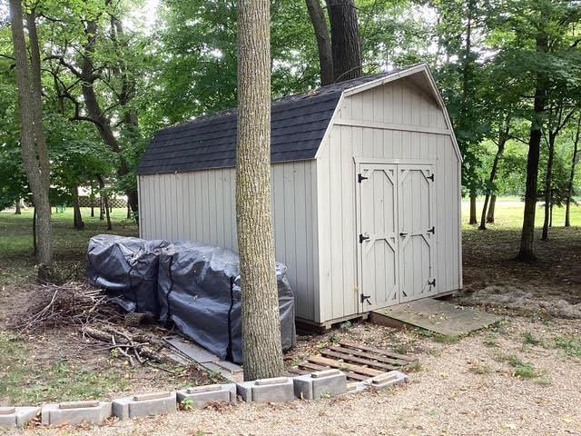 14275 Schuelke Beach Rd NW, Miltona, MN 56354 - view of shed with view of wooded area
