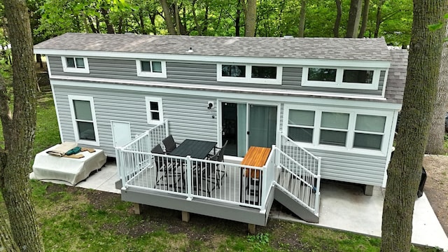 14275 Schuelke Beach Rd NW, Miltona, MN 56354 - rear view of house featuring a deck and a shingled roof