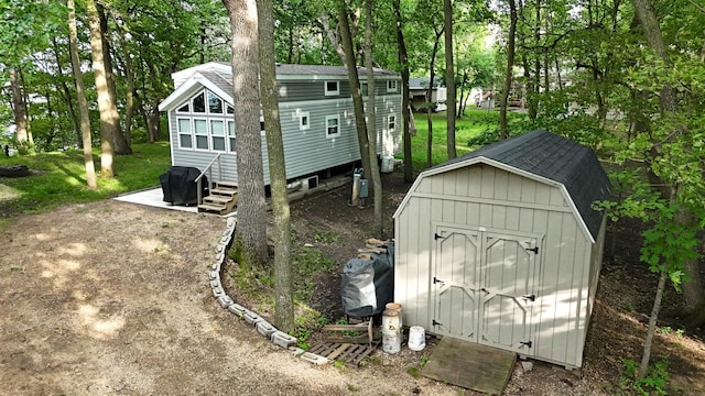 14275 Schuelke Beach Rd NW, Miltona, MN 56354 - view of shed featuring view of scattered trees and entry steps